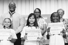 WINNFIELD PRIMARY SCHOOL-Grade 2 Left to right: Karmen Olmos, Miranda Owens, Alexis Tolbert, Princeton Holden. Principal Byron King, Assistant Principal Resa Johnson, Kiwanian Ethel Howell