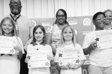 WINNFIELD PRIMARY SCHOOL-Grade 3 Left to right: Passion Burch, Olivia Griffin, Carrie Johnson. Principal Byron King, Assistant Principal Resa Johnson, Kiwanian Ethel Howel