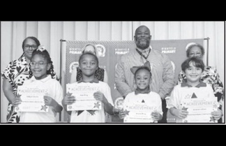 Winnfield Primary School – Second Grade From left: Kaliyah Starks, Noe King, Ariyan King and Andrew Lacour. Assistant Principal Resa Johnson, Kiwanian Mary Lou Blackley, Principal Byron King and Kiwanian Ethel Howell.