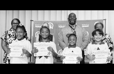 Winnfield Primary School – First Grade From left: Gabrielle Breaux, Sadie Garrett, Dixxie Hernandez and Ellie Stroud.. Assistant Principal Resa Johnson, Kiwanian Mary Lou Blackley, Principal Byron King and Kiwanian Ethel Howell.