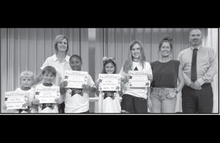 Calvin From left: Cooper Thomas, Marshall Ray, Karlee Knowles, Ava Meadows and Kenna Bonnette. Teacher Kim Dupree, Kiwanian Miranda Atkins and Principal Justin Tinsley.