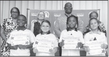 Winnfield Primary School – Third Grade From left: Terrell Jules, Kinlee Higgs, Hayden Jones and Cadence Barthelemy. Assistant Principal Resa Johnson, Kiwanian Mary Lou Blackley, Principal Byron King and Kiwanian Ethel Howell.