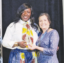 Katina Smith receives 5Year Service Award Pin from the LMCA