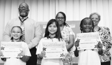 WINNFIELD PRIMARY SCHOOL-Grade 2 Left to right: Karmen Olmos, Miranda Owens, Alexis Tolbert, Princeton Holden. Principal Byron King, Assistant Principal Resa Johnson, Kiwanian Ethel Howell