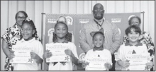 Winnfield Primary School – Second Grade From left: Kaliyah Starks, Noe King, Ariyan King and Andrew Lacour. Assistant Principal Resa Johnson, Kiwanian Mary Lou Blackley, Principal Byron King and Kiwanian Ethel Howell.