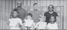 WINNFIELD PRIMARY SCHOOL Grade 1 Left to right: Don’Aria Cockerham, Asher Conner, Wilder Godwin, Royce Philson. Principal Byron King, Kiwanian Troy Rogers, Assistant Principal Resa Johnson.