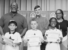 WINNFIELD PRIMARY SCHOOL Grade 3 Left to right: Israel Miranda, Carson Durbin, Moriah Jewitt. Principal Byron King, Kiwanian Troy Rogers, Assistant Principal Resa Johnson.