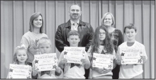 CALVIN Left to right: Scarlett Hatten, Jake Harmon, Jake Garrett, Karis Jacobs, Easton Garrett. Teacher Kim Dupree, Kiwanian Mary Lou Blackley, Principal Justin Tinsley.