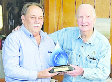 Rusty Reeves, LRWA deputy director, makes a personal presentation to Willie Doherty of the 2024 H.M. “Skeeter” Vickers Award.