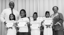 Winnfield Primary School Grade 3 Left to right: Londyn Smith, Chloe Hayes, Savannah Washington, Joy Sapp. Principal Byron King and Kiwanian Ethel Howell