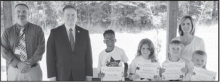 CALVIN Left to right: Kameron Mattox, Anna Bates, Logan Smith, Noah Carson. Not pictured: Kyleigh Chandler. Principal Justin Tinsley, Kiwanian. Bryan Price, Teacher Kim Dupree