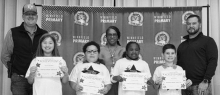 WPS 3rd Grade Left to right: Eva King-Armstrong, Shawn Barron, Raylee McManus. Kiwanian Sheriff Josh McAllister, Assistant Principal Resa Johnson, Kiwanian Chet Atkins.