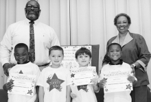 Winnfield Primary School _Kindergarten Left to right: Christian Evans, Cooper Guilliams, Drake Horn, Jayden Rhone. Principal Byron King and Kiwanian Ethel Howell.