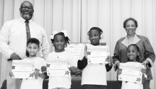 Winnfield Primary School Grade 2 Left to right: Jathen Brady, Carrie Johnson, Tyre Davis, Jaylen Parker. Principal Byron King and Kiwanian Ethel Howell