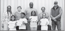 Winnfield Primary School Grade 2 (L-R): Paloma Vasquez-Garcia, Kahlil Wells, Eve King-Armstrong, Passion Burch, Assistant Principal Resa Johnson, Kiwanian Margaret Coon, Principal Byron King, Kiwanians Ethel Howell and Sheriff Josh McAllister.