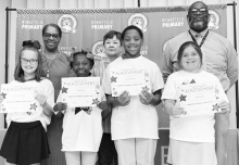WPS Grade 4 Left to right: Kennedy Compton, Laila Evans, Travis Stringer, Sophia Horn. Assistant Principal Resa Johnson, Kiwanian Margaret Coon, Principal Byron King