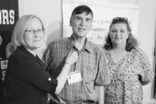 (L–R): Immediate Past President Mary Lou Blackley pins Troy Rogers with his official pin as incoming President-Elect, alongside District 11 Lieutenant Governor Kimberly Bruce Futrell, who presided over the installation ceremony during the Winnfield Kiwa