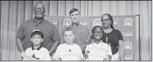 WINNFIELD PRIMARY SCHOOL Grade 2 Left to right: Remyngton Parker, A’Mari Stewart, Angel Cornett, Losie Curry. Principal Byron King, Kiwanian Troy Rogers, Assistant Principal Resa Johnson.