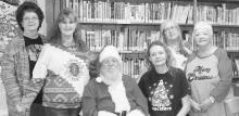 Santa made a special stop in Dodson recently. He stopped by the Winn Parish Dodson Branch Library during their Christmas party. The ladies enjoyed opening gifts and sitting on Santa’s lap to tell him their wishes for Christmas.