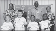 Winnfield Primary School – Kindergarten From left: Bennett Green, Jaxon Worhington, Lyric DeLoach and Chloe Morris. Assistant Principal Resa Johnson, Kiwanian Mary Lou Blackley, Principal Byron King and Kiwanian Ethel Howell.