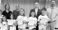 CALVIN Left to right: Memphis Browning, Evelyn Maricelli, Remi Williams, Griffin Rackley, Brody Perot, Teacher Kim Dupree, Kiwanians Mary Lou Blackley and Bryan Price, Principal Justin Tinsley.