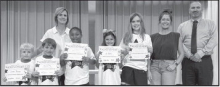 Calvin From left: Cooper Thomas, Marshall Ray, Karlee Knowles, Ava Meadows and Kenna Bonnette. Teacher Kim Dupree, Kiwanian Miranda Atkins and Principal Justin Tinsley.