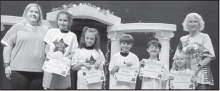 DODSON Left to right: Zoe Muse, Josie Broomfield, Nathan Roppolo, Noah Treadway, Kaylee Blackstock. Principal Wendy Miller, Kiwanian Rita James