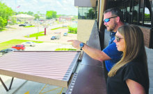 Chet and Miranda Atkins enjoy the view from the balcony