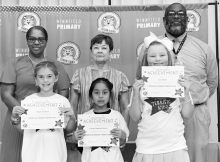 WPS Grade 3 Left to right: Harper Hubbard, Paloma Vazquez-Garcia, Kara Martin. Assistant Principal Resa Johnson, Kiwanian Margaret Coon, Principal Byron King