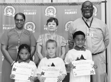 WPS Kindergarten Left to right: Avery Conley, Klaire Hattaway, Marcus Davenport. Assistant Principal Resa Johnson, Kiwanian Margaret Coon, Principal Byron King