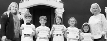 DODSON Left to right: Jace James, Stevie Underwood, Graycee DeSadier, Mattie Claire McBride, Sawyer Boyett. Principal Wendy Miller and Kiwanian Rita James