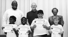 Grade 3 Left to right: Iveyanna Powell, China Allen, Abaham Rustom, Carter Parish, Principal Byron King, Kiwanians Dr. Jerry Pipes and Ethel Howell.