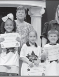 Dodson From left: Creedyn Elliott, Journi Carpenter, Abigail James, Taigen Hanson and Luke Mathews. Kiwanian Margaret Coon and Principal Wendy Miller.