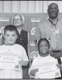 Winnfield Primary School – Kindergarten From left: Bennett Green, Jaxon Worhington, Lyric DeLoach and Chloe Morris. Assistant Principal Resa Johnson, Kiwanian Mary Lou Blackley, Principal Byron King and Kiwanian Ethel Howell.